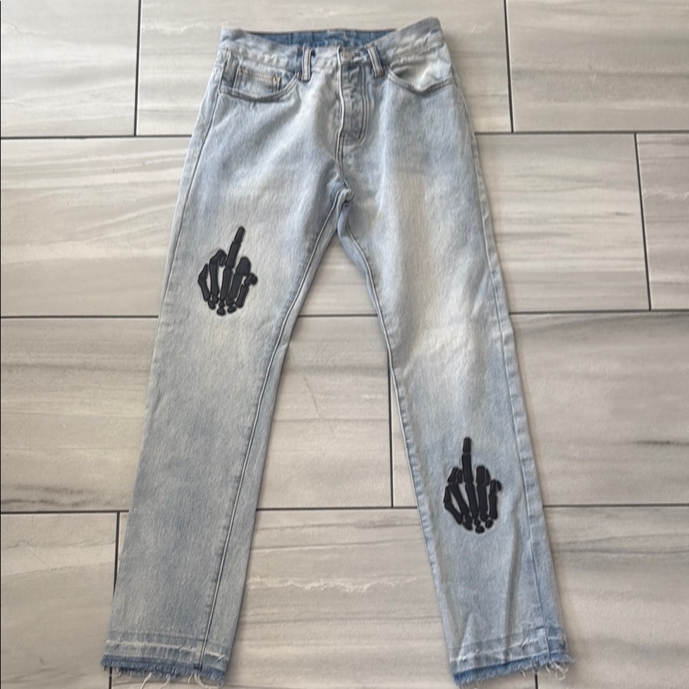 Stylish Light Blue Jeans with Unique Black Design